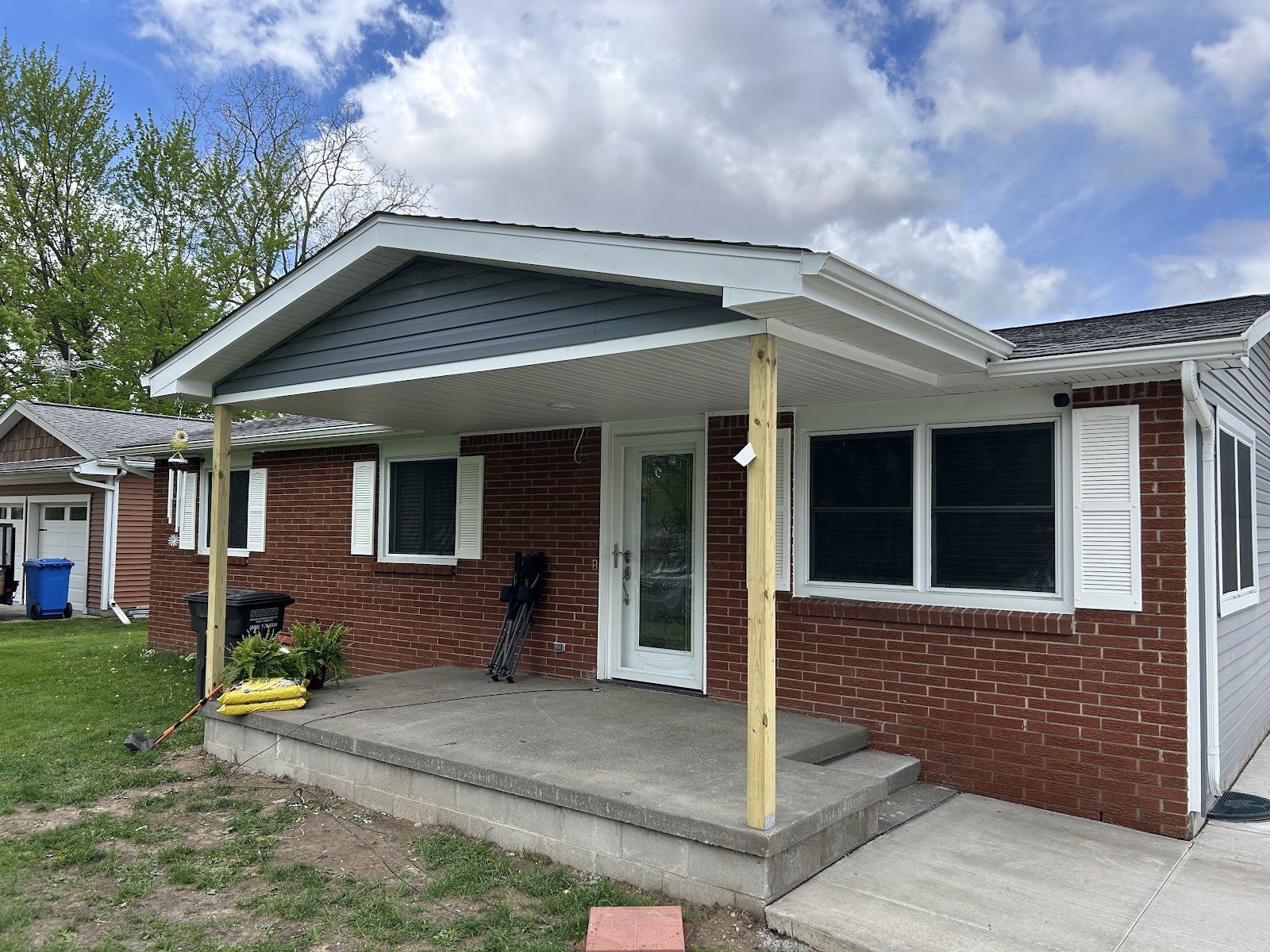 New porch roof over a front stoop, built by Cusumano Home Improvements