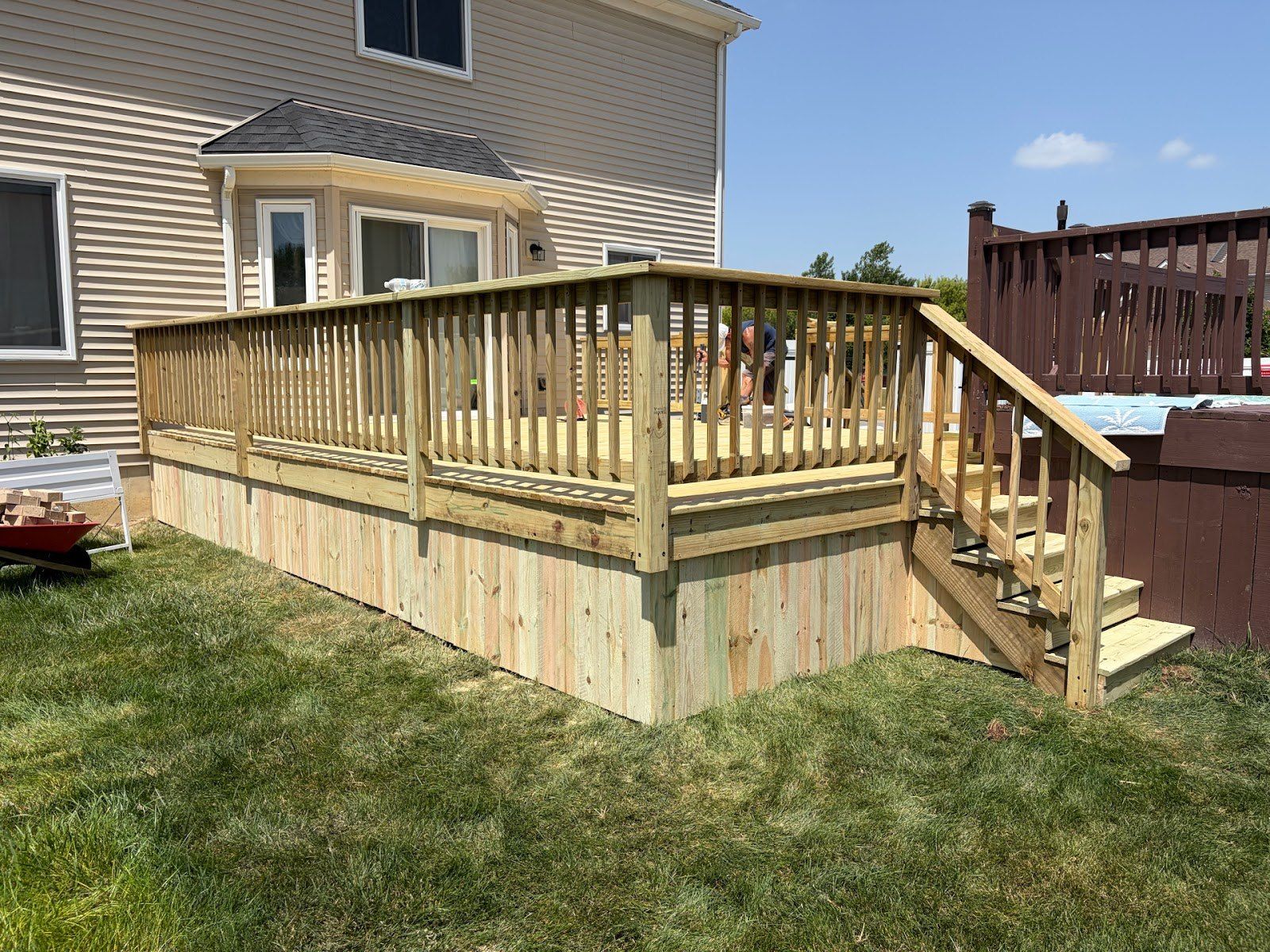 Raised backyard deck with stairs